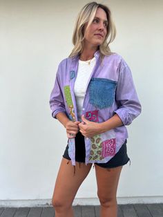 a woman in shorts and a purple jacket