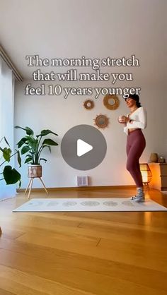 a woman standing on top of a yoga mat in front of a window with the words, the morning stretch that will make you feel 10 years younger