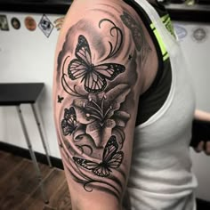 a woman with a butterfly tattoo on her arm