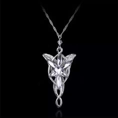 This Is An Outstanding Arwen Evenstar Pendant Necklace Made Of Great Quality Alloy In Silvertone With A S925 Chain Comes With Vintage Metal Jewelry Box In Silver Color The Gift Of An Arwen Evenstar Necklace Princess Arwen Evenstar Gave Her Beautiful Necklace To Aragon To Pledge Her Eternal Love To Him. This Special Gift From An Immortal Elf To A Mortal Man Symbolized Arwen's Decision To Forsake Her Immortality To Be With The Person She Truly Loves. Please See Photos As They Are Part Of The Description Lotr Necklace, Evenstar Necklace, Arwen Evenstar, Princess Jewelry, Princess Necklace, Mens Jewelry Necklace, Stone Pendant Necklace, Crystal Necklace Pendant, Star Pendant