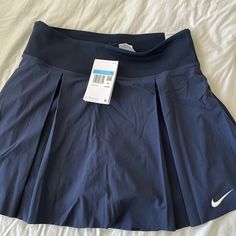 Nwt Nike Tennis Skirt In Navy. Size Medium. Has Built In Shorts With A Pocket. Nike Sporty Short Skirt, Nike Lined Skirt For Spring, Nike Spring Pleated Skirt, Nike Short Lined Skirt, Nike Stretch Lined Skirt Bottoms, Nike Skirted Bottoms For Summer, Nike Summer Pleated Skirt, Nike Pleated Skirt For Summer, Nike Pleated Skirt Fitted Bottoms