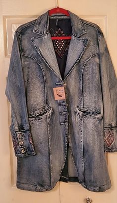 Shop pcazzalino's closet or find the perfect look from millions of stylists. Fast shipping and buyer protection. It's a denim long jacket with embroidery on the cuffs and back of jack.. size XL , but it fits like a large. Very beautiful embroidery. Western Denim Outerwear With Pockets, Western Style Long Sleeve Denim Outerwear, Western Long Sleeve Denim Outerwear, Spring Western Denim Outerwear, Western Style Medium Wash Outerwear For Spring, Western Style Fitted Medium Wash Outerwear, Fitted Western Style Medium Wash Outerwear, Denim Long Jacket, Jacket With Embroidery