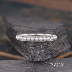 a close up of a ring on a rock