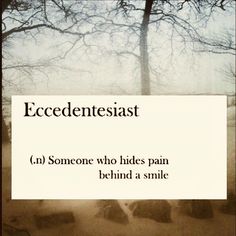 a white sign that reads, ecedenteiast someone who hides pain behind a smile