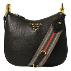 This Prada handbag is a perfect everyday bag. Pebbled black leather paired with orange and blue web stripe nylon strap. The gold Prada logo looks amazing with the black leather. The strap pairs with the classic black leather to add a pop of color to your everyday wardrobe. Wear as a shoulder bag, or as a crossbody. Model: 1BC166 - 1BC052 Black Vitello Phenix leather Gold-tone hardware Top zip closure One interior zip pocket One interior slip pocket Interior signature Prada nylon jacquard lining Prada Purses, Fashion Basics, Prada Handbag, Prada Nylon, Prada Logo, Leather Shoulder Handbags, Prada Crossbody, Prada Handbags, Crochet Bags