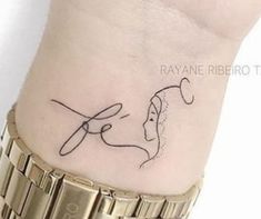 a woman's wrist with a tattoo on it