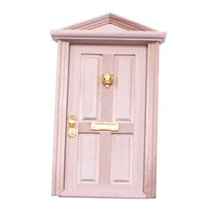 a pink wooden door with gold handles