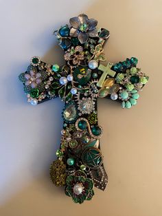 a cross made out of beads and other items