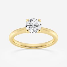 a yellow gold engagement ring with a round diamond in the center, on a white background