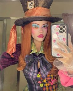 a mannequin wearing a hat and holding a cell phone in her right hand