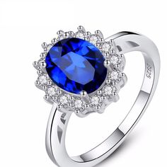 "Princess Diana" luxury gemstone ring with blue sapphire stone and 925 sterling silver is the perfect gift as an engagement ring for a woman. Specification: Style: BohemiaModel Number: SR0078Item Type: RingsGender: WomenMain Stone: SAPPHIREShape Pattern: OvalSide Stone: Other Artificial materialMetal: 925 Sterling SilverSilver Content:at least 92.5%Occasion: Engagement, Wedding, AnniversarySize: 5 6 7 8 9Net Weight: 3.76g Sapphire Blue Weddings, Cubic Zirconia Wedding Rings, Affordable Engagement Rings, Cute Engagement Rings, Sterling Silver Promise Rings, Health Hair, Ring Trends, Blue Ring, Sapphire Rings