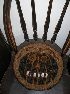 a wooden chair with an animal motif on it