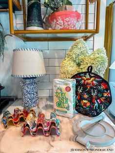 a table topped with vases and other decorative items