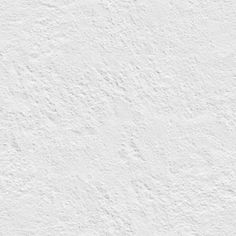 a white stucco wall textured with light gray paint