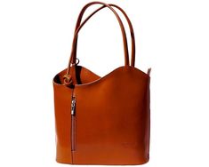 This versatile handbag is unique! It’s simple sleek design is elegant for special occasions or perfect for business. It can be converted to a backpack for a more casual look. Available in rich colors. Stylish Vera Pelle - Genuine Italian Leather - Made in Italy Stamped with "Florence Made in Italy" on front Secure bag with zippered closure, zippered pockets inside and out as well as a zippered section that separates main compartment into 2 spaces Two top handles to carry as shoulder bag or pull Handmade Leather Shoulder Bag, Italian Leather Purse, Italian Leather Handbags, Baked Apple, Flap Backpack, Chloe Handbags, Convertible Backpack, Coach Horse And Carriage Tote, Leather Handbags Tote