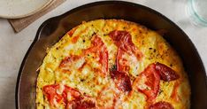 a pizza sitting in a pan on top of a table