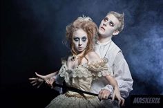 a man and woman dressed up as the bride and groom with makeup on their faces