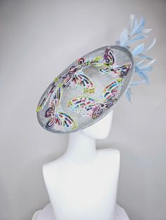 From the 2024 Featured Milliner of the Kentucky Derby Museum  kentucky derby hat fascinator light blue sinamay saucer light blue feathers sequin embroidered rainbow butterflies  headband attachment each hat is totally one of a kind! no two are alike! I can probably add feathers, flowers etc to existing hats for a small fee. I cannot remove anything from existing hats. Just message me and see if we can make it work! :) I cannot make custom order from scratch. My schedule is unfortunately too craz Rainbow Butterflies, Derby Hats Fascinators, Kentucky Derby Hat, Blue Feather, Fascinator Hats, Derby Hats, Kentucky Derby, Kentucky, Fascinator