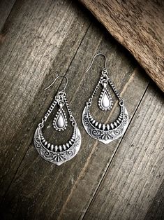 "These silver chandeliers have a rustic boho feel and are the perfect size. They have stainless steel ear wires and measure 2.75\" long and 1.5\" wide. ▲ To see more, click here to return to my shop: https://www.etsy.com/shop/AspenGlowStudio ▲ Don't forget to favorite my shop for updates Many of my designs have natural stones, these stones will slightly vary from one another so remember that yours may not be exactly like the ones pictured but they will be VERY similar. Please be careful with you Bohemian Silver Teardrop Earrings, Bohemian Oxidized Teardrop Dangle Earrings, Bohemian Teardrop Oxidized Earrings, Bohemian Silver Oxidized Teardrop Earrings, Bohemian Sterling Silver Chandelier Earrings, Bohemian Teardrop Dangle Earrings With Oxidized Finish, Bohemian Sterling Silver Chandelier Earrings For Festivals, Bohemian Sterling Silver Teardrop Earrings, Bohemian Pierced Teardrop Earrings In Sterling Silver