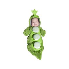 a baby in a peas costume laying on its back