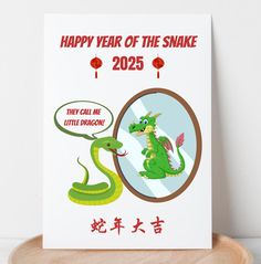 a chinese new year card with a green dragon and the words happy year of the snake