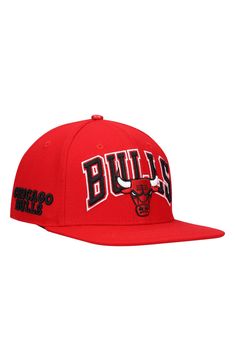 Show off your Chicago Bulls fandom with this Wordmark Logo hat by Pro Standard. It features bold embroidery of the team's wordmark and logo on the front with raised details on the right side and back. This cap also includes a snap closure to ensure a comfy fit as you rep your Chicago Bulls. Material: 70% Acrylic/30% Wool  Hat; 100% Leather  Top Button High Crown Structured fit Flat bill Snapback One size fits most Embroidered graphics with raised detail Leather top button Six panels with eyelets Sporty Baseball Cap With Logo Print, Sporty Logo Print Baseball Cap, Sporty Curved Brim Hat With Logo Print, Sporty Visor Hat With Logo Print, Sports Cap With Logo Print, Sporty Logo Cap, Sports Baseball Cap With Logo Print, Snapback Fitted Hat With Team Logo, Throwback Snapback Fitted Hat For Game Day