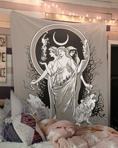 a tapestry hanging on the wall above a bed