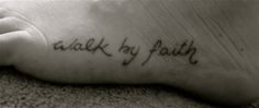 a black and white photo of a foot with the words walk by faith written on it