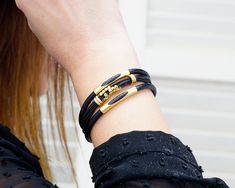 Description:  Women's Wrap Leather Bracelet, Gold Tube Leather Bracelet, Gift Bracelets for Girlfriend, Stackable bracelets and Leather Cuff for Women. I make the bracelets from genuine leather cord, from zinc alloy (leads free) which has silver and gold plated or antique bronze oxidation. All the materials I use are hypoallergenic. I am happy to work with you to come up with a completely different and custom design to gifts. These specially designed bracelets will be a nice gift for your loved ones on their special occasions. Our made genuine leather bracelets,   - Bracelets Leather for Woman,  - Bracelet for mens - Wedding Gifts,  - Mothers and Fathers Day Gifts,  - Anniversary Gifts,  - Birthday Gifts,  - Valentines Day Gifts,  - Hapy New Year Gifts,  - Christmas Gifts and for any other Adjustable Leather Bracelet As A Gift, Trendy Double Band Bracelets As Gift, Adjustable Leather Bracelet With Wrist Strap As Gift, Trendy Double Band Bracelets For Gifts, Adjustable Gold Leather Friendship Bracelet, Gold Leather Bracelet With Black Band For Gift, Gold Leather Bracelet With Black Band As Gift, Leather Bracelet With Wrist Strap As Gift, Gift Leather Bracelet With Wrist Strap