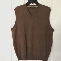 Bobby Jones Mens Sleeveless Brown Merino Wool Golf Sweater Vest. Size Large. Armpit-To-Armpit 23.5", Length 28". 100% Merino Wool In Brown. New W/O Tags, Suitable For Gifting. Classic Sleeveless Vest For Layering, Classic V-neck Vest, Casual Brown Tank Vest, Sleeveless Brown Sweater Vest For Layering, Brown Sleeveless Sweater Vest For Work, Classic Sleeveless Tops For Fall, Classic Sleeveless Fall Tops, Classic Brown Vest Top, Brown Cotton Sweater Vest For Layering