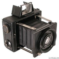 an old fashioned camera is shown on a white background