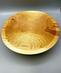 a wooden plate sitting on top of a table