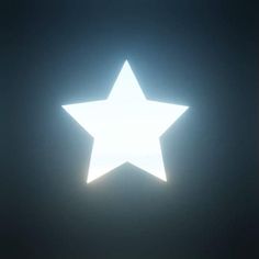 a white star is shining in the dark