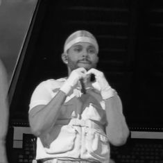 black and white photograph of a man holding something in his hands