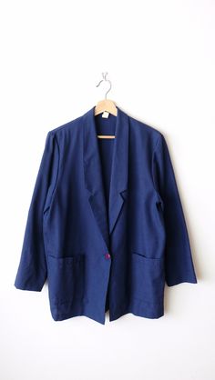 "Vintage Dark Blue/ Navy Blue Slouchy tailored Jacket/Minimal Blazer/Light Jacket. Measurements Length: 28 1/2\" Armpit to armpit: 21\" Shoulder: 16 1/2\"  Shoulder to end of sleeve: 22\" Condition: Gently used. There's no holes or stains. Good condition. ※Please read the policy before you purchase※" Blue Single Button Blazer For Fall, Fall Blue Blazer With Hidden Button Closure, Blue Cotton Outerwear With Suit Collar, Blue Blazer With Hidden Button Closure For Fall, Blue Long Sleeve Blazer For Work, Blue Career Blazer With Notch Lapel, Career Blue Notch Lapel Blazer, Blue Career Blazer With Suit Collar, Career Notch Lapel Blue Blazer