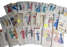 an assortment of vintage sewing patterns from the 1950's and early 1960s's