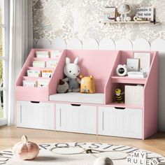 a child's room with pink and white storage bins, bookshelves and stuffed animals