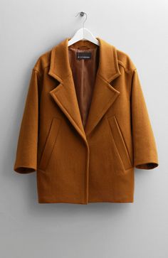 Color: MustardFabric: 100% Wool. Lining - 100% RayonCare: Dry clean only Wool all-over mustard coat with two front pockets and button front detail. Domed Sleeve. 75 cm long. Consider wearing at a temperature 59-32°F (+15/0°C) Made in USA. Brown Wool Blazer, Mustard Coat, Wool Short Coat, Double Breasted Vest, Khaki Trench, Khaki Trench Coat, Hooded Trench Coat, Hooded Raincoat, Cotton Vest