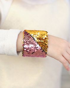 A fun accessory for your little trendsetter. These reversible sequin bracelet cuffs are flippin' fun! Trendy Adjustable Cuff Bracelet For Party, Adjustable Cuff Bracelet For Parties, Fun Adjustable Beaded Bracelets For Party, Fun Multicolor Bracelets For Party, Adjustable Cuff Bracelet For Party, Sparkling Stones Cuff Bracelet Gift, Gold Adjustable Wristlet For Party, Adjustable Gold Wristlet For Party, Pink Party Cuff Bracelet Bangle