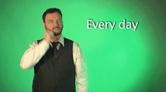 a man standing in front of a green screen with the words every day written on it