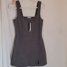 The Is A Dress From Urban Outfitters. It Is A Size Medium. It's Dark Gray With Small White Daisies On It. This Item Is Nwt. It Measures 17 Inches From Armpit To Armpit And 32 Inches From Shoulder To Hem Fitted Lined Sundress For Date Night, Fitted Cotton Sundress With Lining, Fitted Cotton Sundress Lined, Fitted Mini Dress From Urban Outfitters, Urban Outfitters Fitted Summer Mini Dress, Fitted Mini Dress By Urban Outfitters, Fitted Mini Dress By Urban Outfitters For Summer, Fitted Urban Outfitters Mini Dress, Fitted Cotton Sundress For Date Night