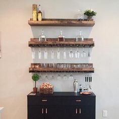 there is a shelf with wine glasses on it