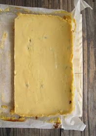 a piece of cheese is sitting on top of some parchment paper and it's ready to be baked