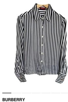 Beautiful Burberry silk shirt. It is a minimalist two-tone model with black and white stripes. It has tortoiseshell buttons with the brand's logo and two gold buttons on the cuffs. The anagram logo is black on the right side. Retains the interior composition label. The size is equivalent to an international M. 💯 % silk. Interior Composition, Burberry Shirt, Burberry Vintage, Vintage Burberry, Black And White Stripes, Gold Buttons, Silk Shirt, Striped Shirt, Etsy Vintage