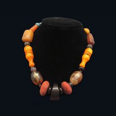 This gorgeous Middle Eastern tribal statement necklace is made of a variety of vintage beads, including amber, turquoise, Faturan, Bakelite and natural red sponge coral. Circa 1940. Text Gift, Sponge Coral, Vintage Beads, Coral Necklace, Scarf Gift, Fabric Trim, Natural Red, Middle Eastern, Bohemian Decor