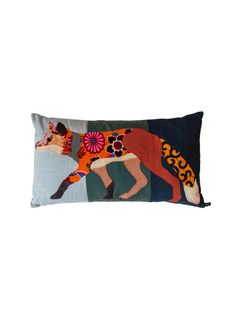 a decorative pillow with a horse on it