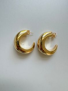 Half Moon Hoops. Elegant statement hoops. Lightweight with hollow interior. Very comfortable. Posts. Earrings measures approximately 1.50” 18kt Gold filled 1/2” wide Elegant Gold Half Moon Hoop Earrings, Elegant Half Moon Gold Hoop Earrings, Gold Half Moon Hoop Earrings, Modern Gold Crescent Hoop Earrings, Modern Crescent Yellow Gold Hoop Earrings, Modern Gold Crescent Earrings, Modern Crescent Hoop Earrings For Everyday, Modern Crescent Hoop Earrings, Pierced, Modern Crescent Hoop Earrings