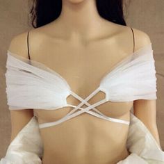 a female mannequin wearing a white dress and gloves