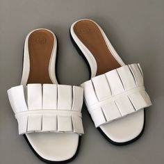 Pleated White Leather Sandals White Leather Sole Mules For Summer, White Mules With Leather Sole For Summer, Chic Leather Sole Flats For Beach, Chic Beach Flats With Leather Sole, White Flat Sandals With Leather Sole, Chic White Sandals With Leather Sole, Chic White Flat Sandals, Chic White Flat Slides, White Slides With Leather Sole For Summer