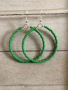 Hoop earrings are simple and lightweight. Seed beaded hoop earrings are 2 inches, handmade earrings will pair perfectly as a formal or casual accessory. Seed Bead Earrings * Perfect best friend gift!  * 2 inch earrings Earrings are READY TO SHIP TODAY!  ADD A BOX https://www.etsy.com/listing/1829605195/ MY ENTIRE COLLECTION https://www.etsy.com/shop/MiksJewelryShop   Thank you for supporting handmade and for visiting my corner of the internet. Please message me with any questions. Don't forget t Summer Dangle Hoop Earrings With Tiny Beads, Green Bohemian Circle Earrings, Bohemian Green Circular Earrings, Green Hoop Earrings With Ear Wire, Small Hoop Earrings With Tiny Beads For Summer, Handmade Adjustable Green Hoop Earrings, Green Beaded Hoop Earrings For Summer, Green Beaded Dangle Hoop Earrings, Adjustable Handmade Green Hoop Earrings